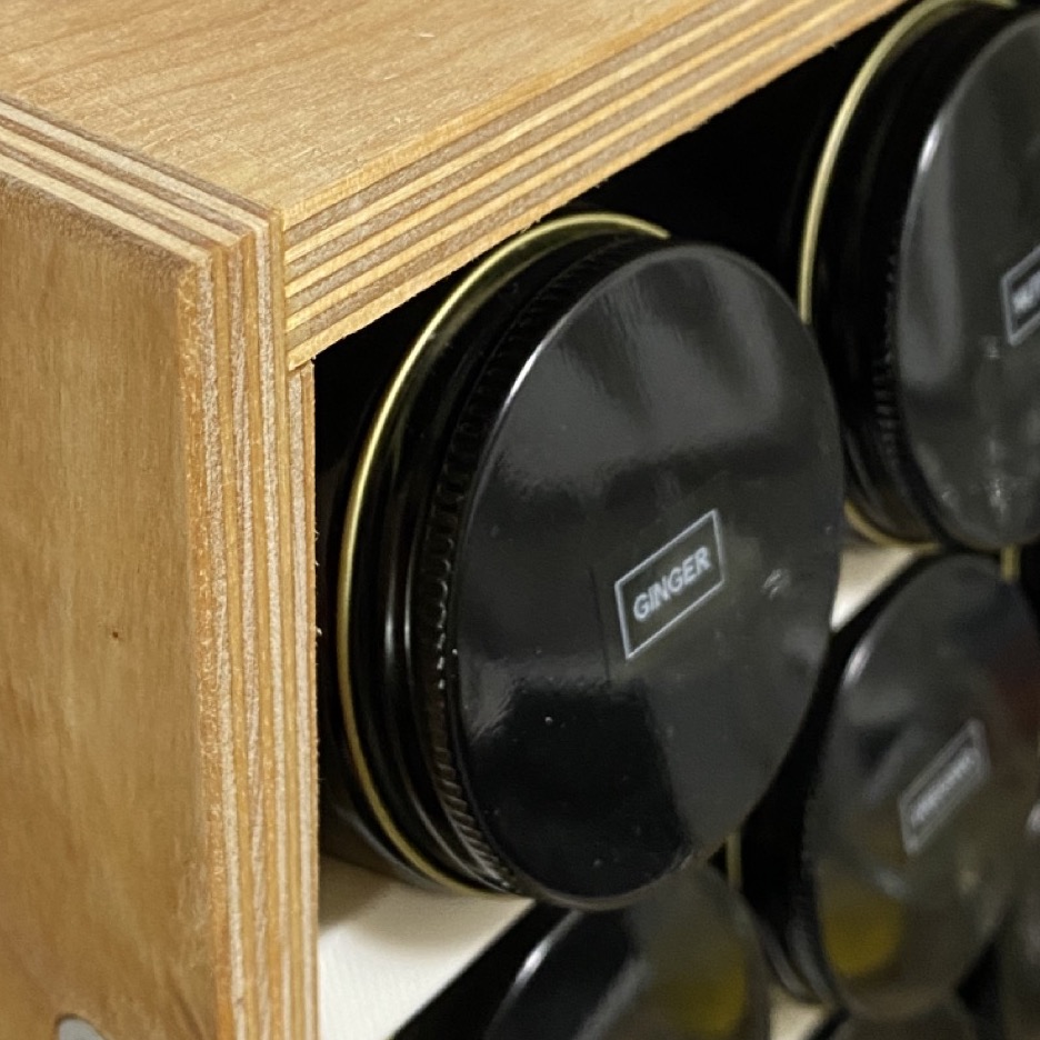 Closeup of upper corner of spice rack.